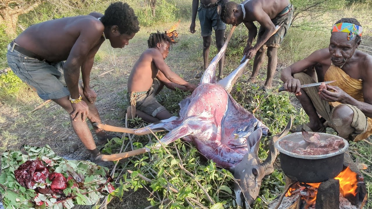poachers skinning an anelope